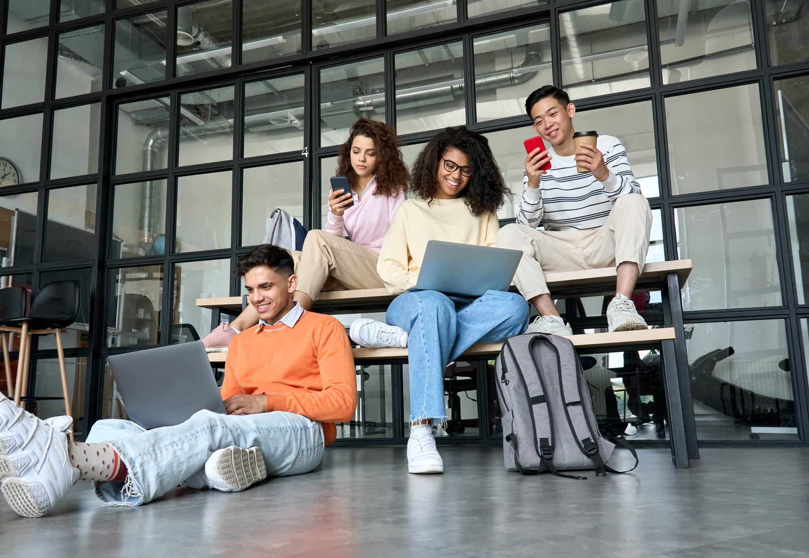 Group of Students Using Gadgets in the Campus