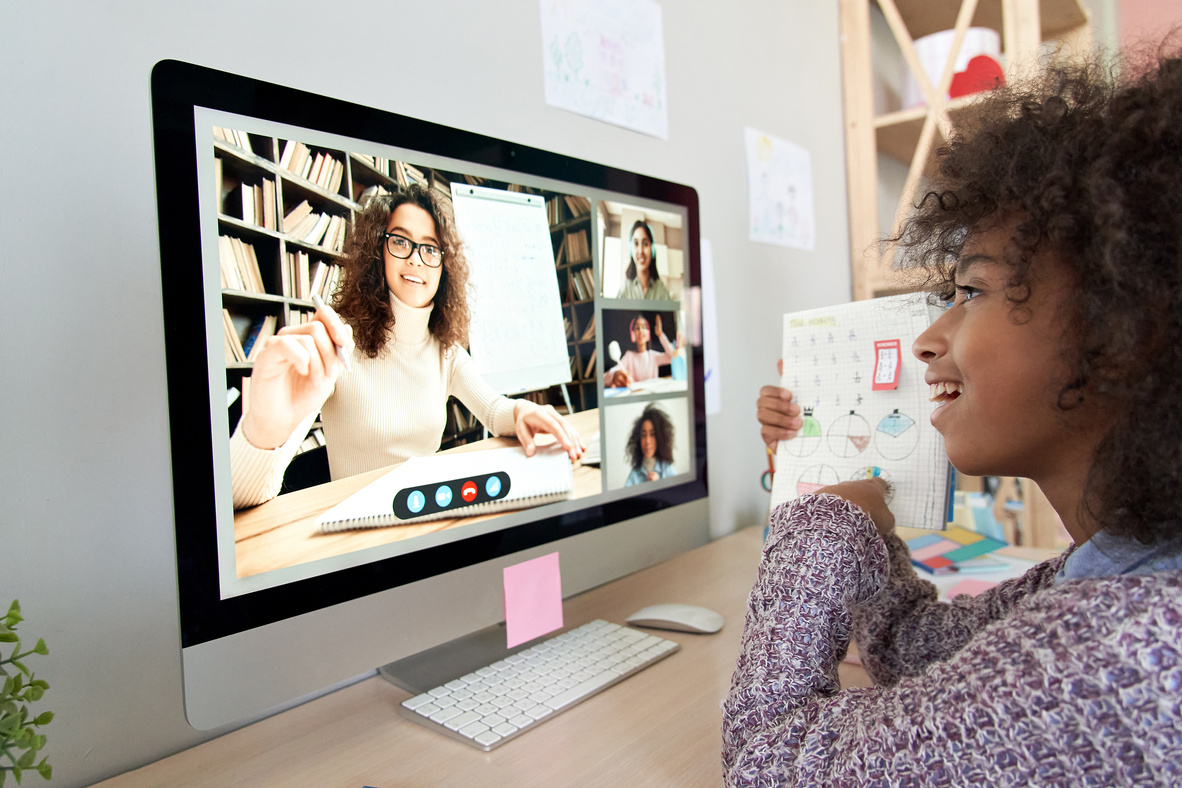 African Kid Girl Distance Learning during Online Group Class with Tutor.